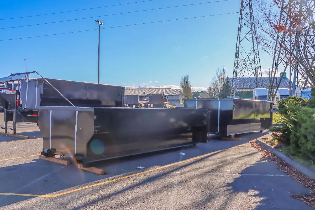 Roll-off dumpster ready for waste disposal at job site for Concrete Dumpster Rental in Burlington